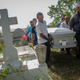 Mourners carry the casket of Wilfredo Torres Rivera, 58, who died Oct. 13, 2017, after jumping off a bridge into a lake, three weeks after Hurricane Maria, on Oct. 19, 2017, in Utuado, Puerto Rico. Rivera’s family said he suffered from depression and schizophrenia and had been caring for his 92-year-old mother in a home without electricity or water in the aftermath of Maria. While the government has ruled his death a suicide, the family believes his death should be classified as a death caused by Hurricane Maria. (Mario Tama/Getty Images)